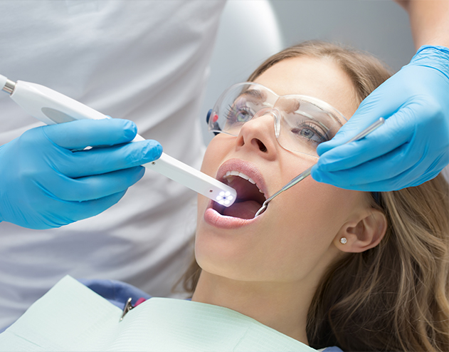 Dentist giving a patient a dental exam