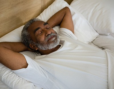 Man sleeping in a bed