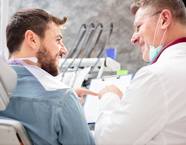 Patient in Castle Rock talking to dentist about cosmetic dental bonding