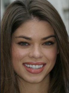 Young brunette woman smiling after dental work