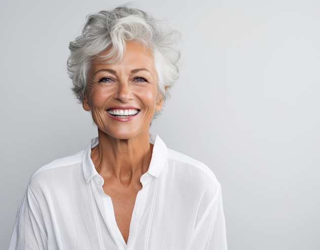 Woman with short gray hair smiling