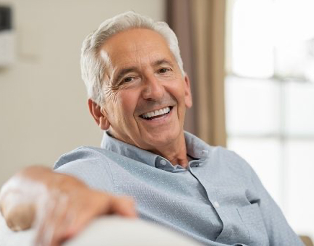 Smiling man sitting on couch