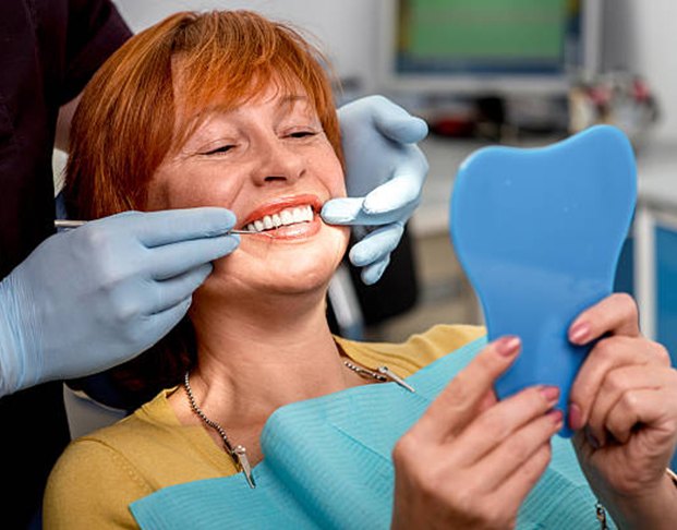 Woman being fitted for a denture