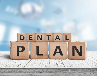 Blocks spell “dental plan”