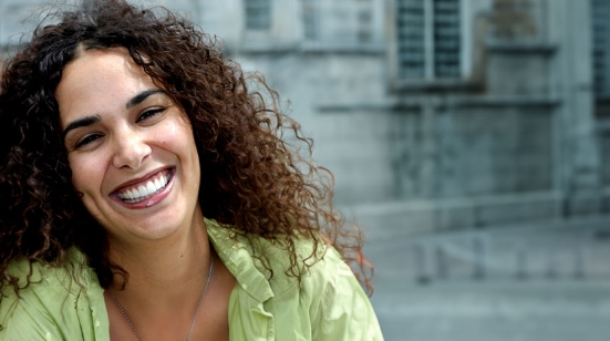 Smiling woman in light green blouse