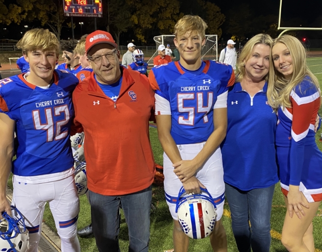 Doctor Radz with his family at a football game