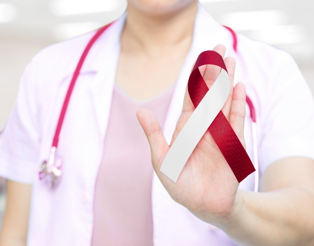 Doctor holding a dark red ribbon