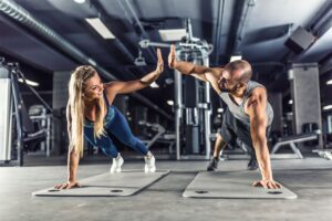 People high-fiving mid-plank